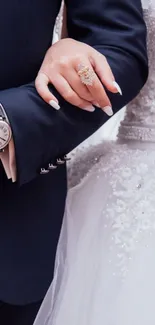 Bride and groom holding hands in elegant wedding attire.