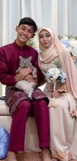 Elegant wedding couple with a cat and floral decor.