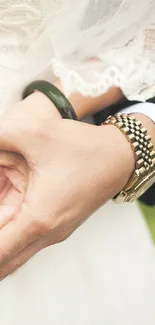 Close-up of elegant hands with jewelry, capturing wedding grace.