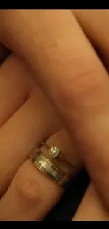 Close-up of hands with wedding ring on finger, conveying love and unity.