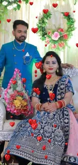 Elegant wedding stage with couple and floral decor.