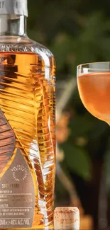 Elegant whiskey bottle and cocktail glass set on a cozy background.