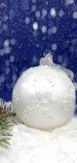 Elegant white Christmas ornament with winter snow on blue backdrop.