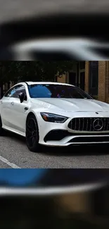 White luxury car on city street mobile wallpaper.