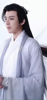 Elegant portrayal in traditional white robe.