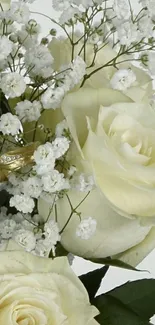 Elegant white roses and delicate flowers in a lush bouquet wallpaper.