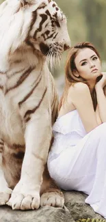 Majestic white tiger sits beside a woman in white dress, exuding elegance.