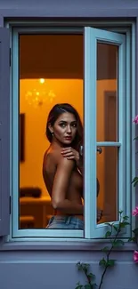 Elegant woman gazing through window framed by pink flowers.