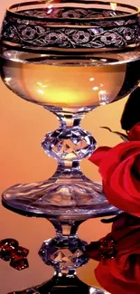 Elegant wine glass with red rose reflection.