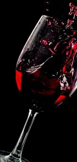 Elegant splash of red wine against a black background.