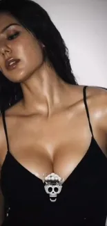 Woman wearing a black dress and striking a stylish pose.