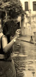 Woman walking in a sepia-toned city rain scene.