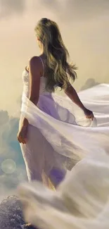 Woman in flowing white dress amidst dreamy clouds.