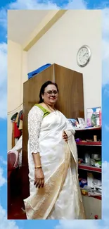 Elegant woman in a white saree with a sky blue background.