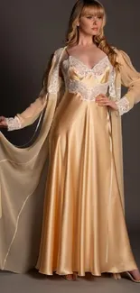 Woman in a flowing champagne satin gown with lace detailing.