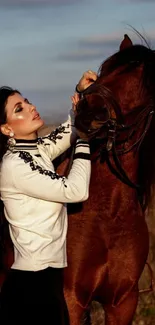 Elegant woman with brown horse in field.