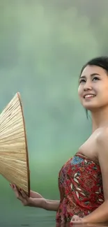 Woman with traditional cone hat in a serene setting.