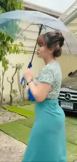 Woman holding a clear umbrella in garden