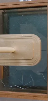 Wooden frame with glass panel and modern design.