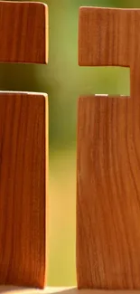 Elegant wooden cross against a blurred background.