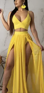 Woman in elegant yellow dress with stylish earrings.