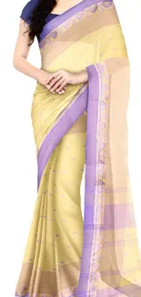 Elegant yellow saree with purple border.