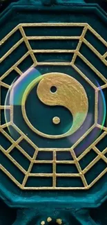 Yin Yang symbol with gold lines on teal background with octagonal pattern.