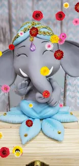 Elephant figurine with colorful flowers on a wooden base.