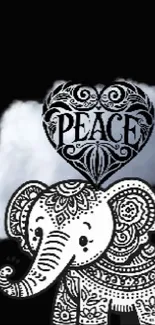 Intricate black and white elephant with heart and peace design on black background.