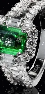 Emerald ring with snowflake design on black background.