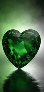 Emerald heart gemstone on misty background for mobile wallpaper.