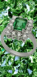 Emerald ring with diamonds on a crystal background wallpaper.