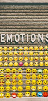 Board with various emojis expressing emotions for a mobile wallpaper.