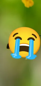 Crying emoji on vibrant green mobile wallpaper.