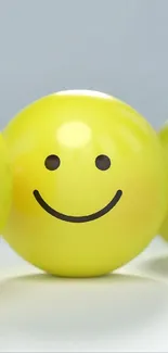 Yellow 3D emoticons display various emotions on a light background.