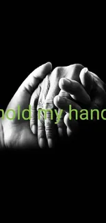 Two hands holding on a black background with green text.