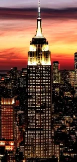 Empire State Building at sunset with New York City skyline.