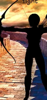 Silhouette of an archer at sunset on a brick path.