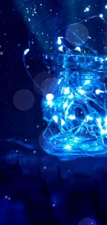 Enchanting blue jar with glowing fairy lights, casting a magical glow.