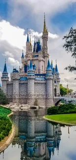 Enchanting castle reflecting in water with a blue sky background.