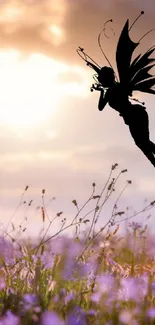 Silhouette of a fairy at sunrise with wildflowers.