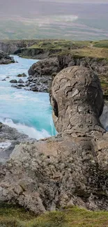 Mystical stone figure overlooking a scenic river and castle in a green landscape.