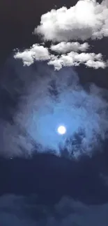 Luminous moon in a dark, cloudy night sky wallpaper.