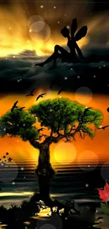 Silhouette of a fairy and glowing tree at sunset with an enchanted sky.