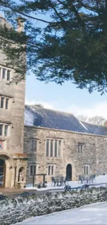 Winter view of Boringdon Hall Hotel with snow-covered grounds and stone architecture.