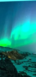 Vibrant Aurora Borealis over snowy landscape with starry sky.