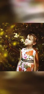 Young girl in floral dress with autumn leaves background.