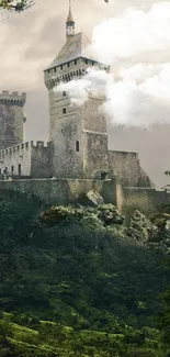 Misty castle surrounded by lush green forest and hills.