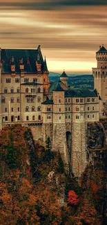 Majestic castle surrounded by autumn foliage under sweeping skies