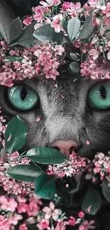 Cat with green eyes peeking through pink flowers, creating a stunning mobile wallpaper.